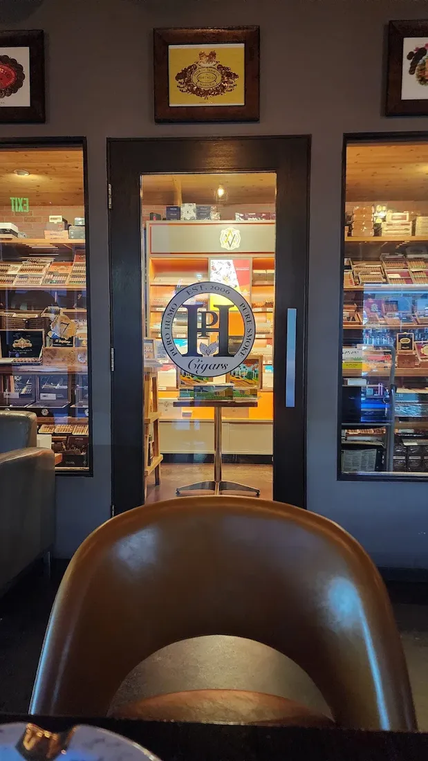 The Puro Humo walk-in humidor, seen from a leather lounge chair